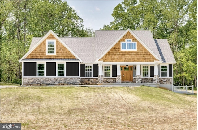 craftsman house with a front lawn