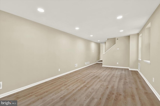 basement featuring light wood-type flooring