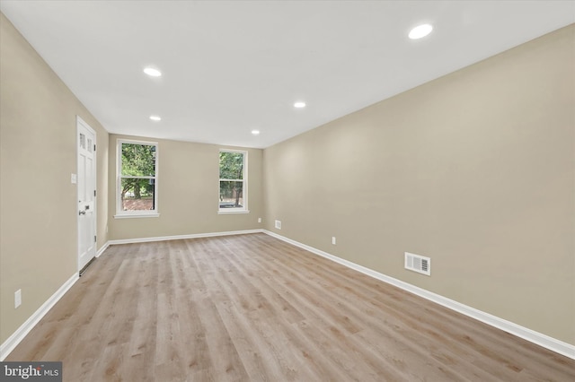 spare room featuring light wood-type flooring