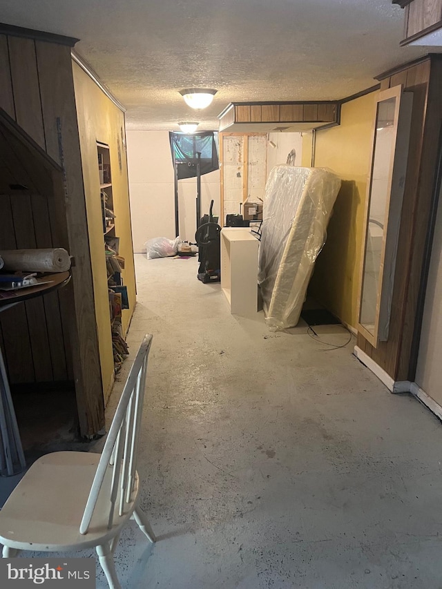 basement featuring a textured ceiling