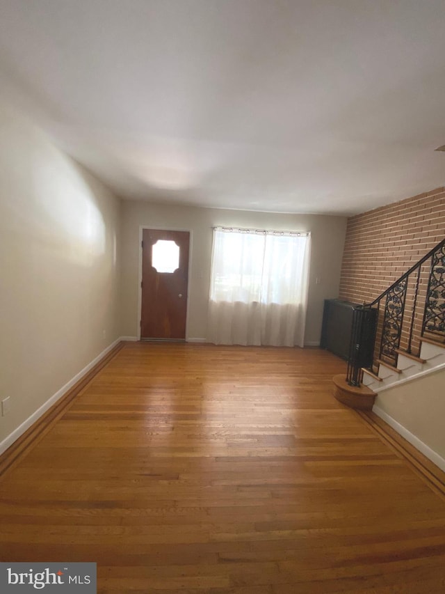 foyer entrance featuring hardwood / wood-style floors