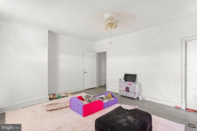 recreation room featuring ceiling fan and hardwood / wood-style floors