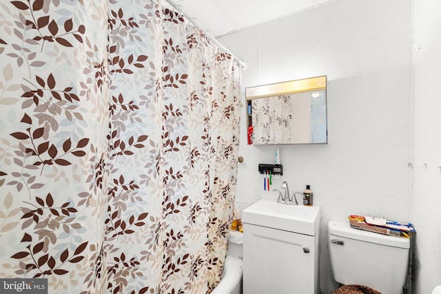 full bathroom featuring vanity, shower / bath combination with curtain, and toilet