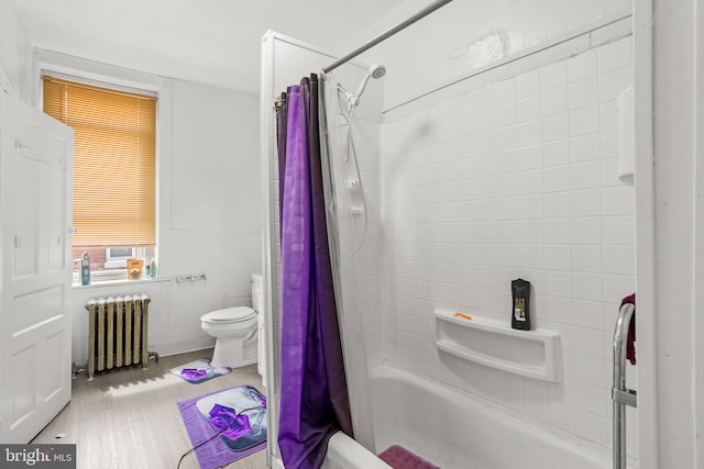 bathroom featuring shower / bath combo, wood-type flooring, radiator heating unit, and toilet