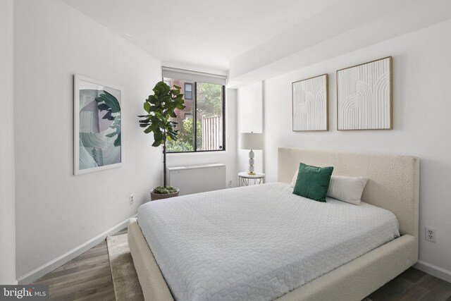 bedroom featuring dark wood-type flooring