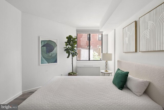 bedroom featuring dark hardwood / wood-style flooring