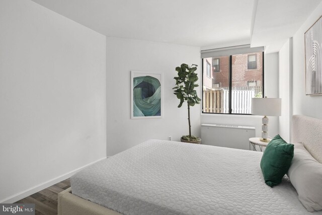 bedroom featuring hardwood / wood-style flooring