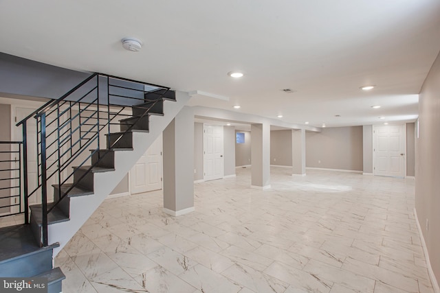 basement featuring light tile patterned flooring