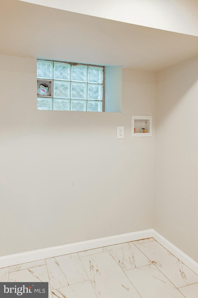 clothes washing area with tile patterned floors and hookup for a washing machine