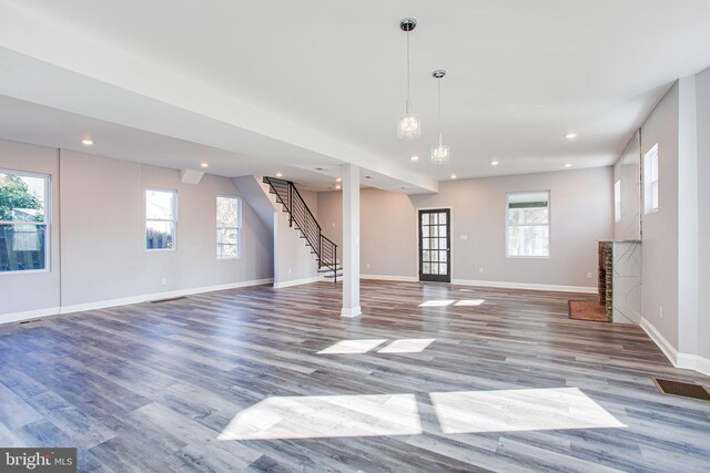 unfurnished living room featuring wood-type flooring