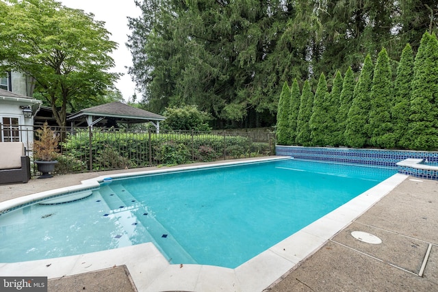 view of swimming pool featuring a gazebo