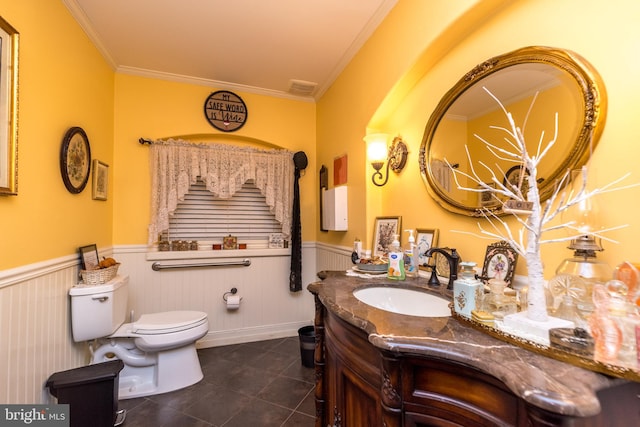 bathroom with crown molding, toilet, vanity, and tile patterned flooring