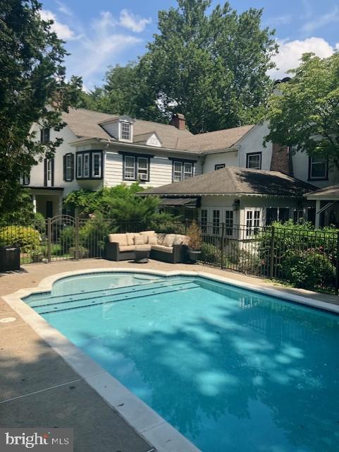 view of pool with outdoor lounge area and a patio area