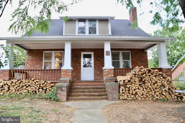 view of front of property featuring covered porch