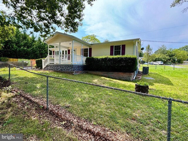 view of front of house with a front lawn and a porch