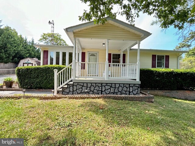 view of front of property with a front lawn and a porch