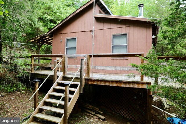 rear view of house with a wooden deck