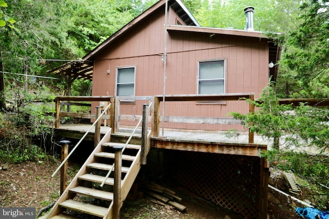 view of home's exterior with a wooden deck