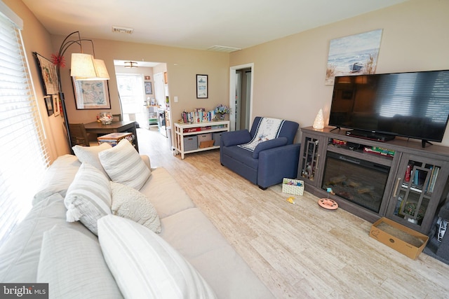 living room with visible vents and wood finished floors