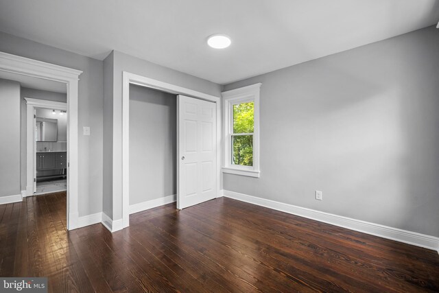 unfurnished room featuring hardwood / wood-style flooring