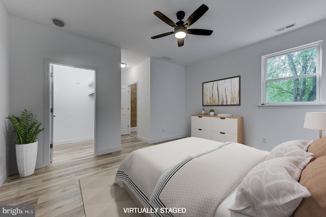 bedroom featuring ceiling fan and light hardwood / wood-style floors