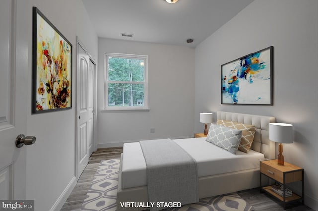 bedroom featuring light wood-type flooring