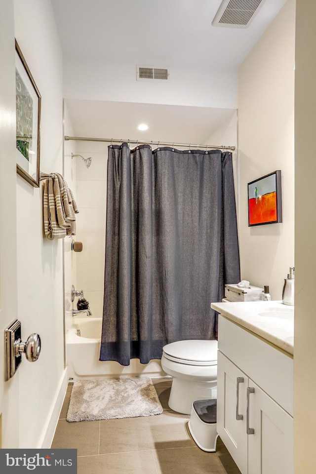 full bathroom featuring vanity, tile patterned floors, toilet, and shower / bath combo with shower curtain