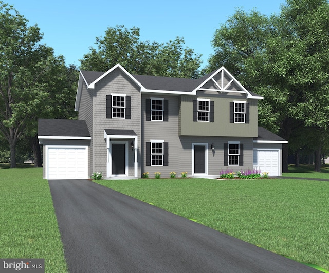 view of front of house with a garage and a front lawn