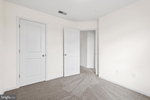 unfurnished bedroom with light carpet