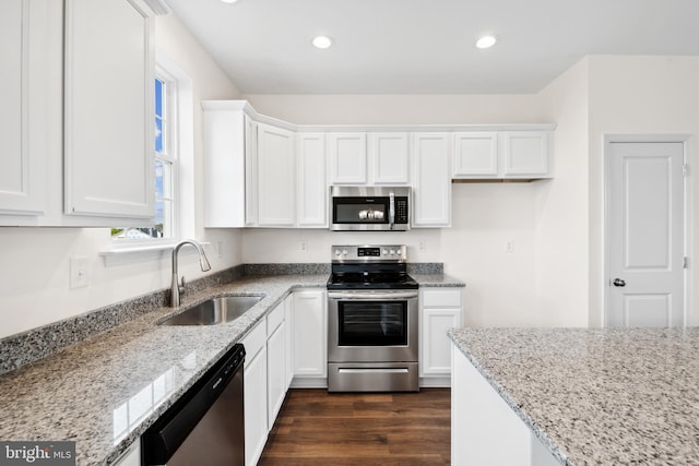 kitchen featuring sink, stainless steel appliances, and white cabinets