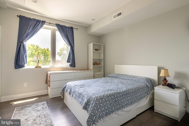 bedroom featuring dark hardwood / wood-style floors