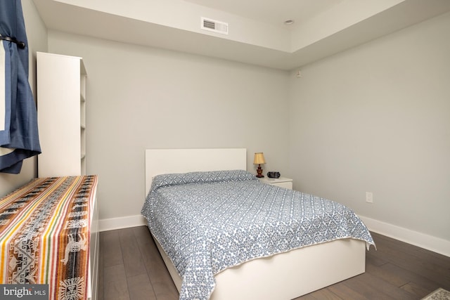 bedroom with hardwood / wood-style flooring