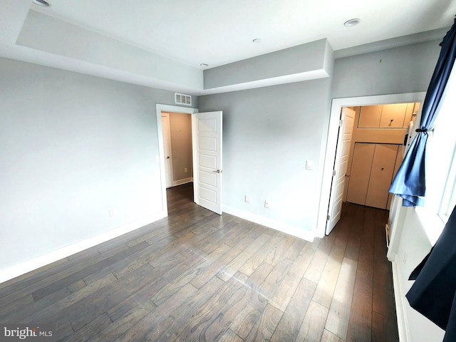 unfurnished bedroom featuring hardwood / wood-style flooring