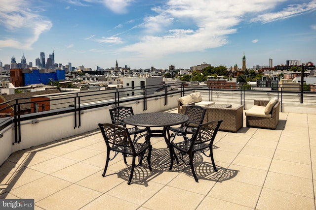 view of patio featuring a balcony