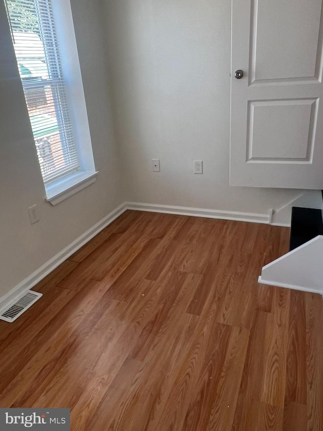 unfurnished dining area featuring hardwood / wood-style floors