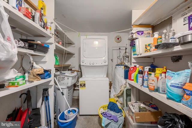 laundry area featuring stacked washer and dryer