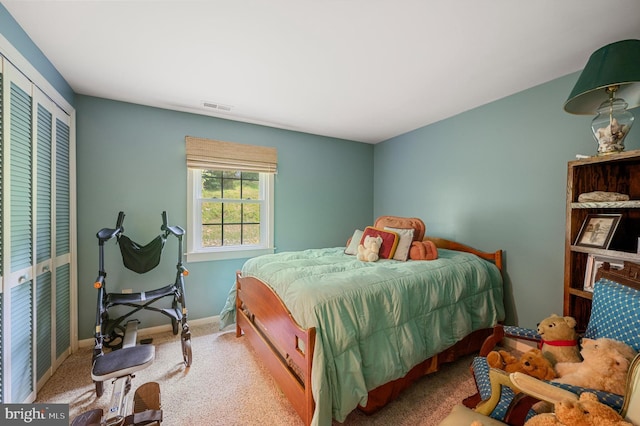 bedroom featuring a closet and carpet flooring