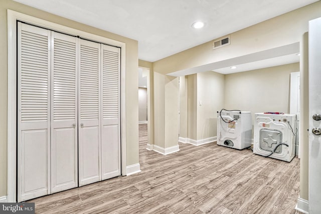 washroom with light hardwood / wood-style flooring