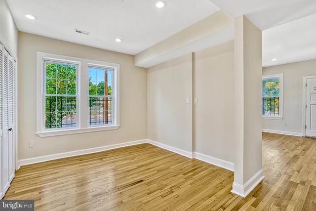 spare room with light wood-type flooring