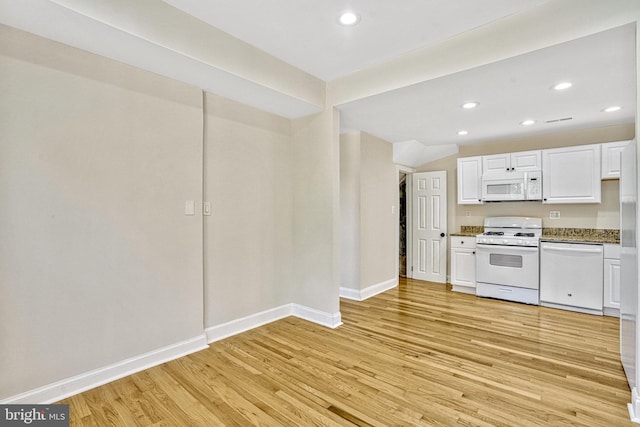 kitchen featuring light hardwood / wood-style flooring, white appliances, and white cabinets