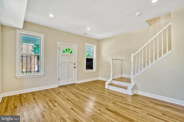 foyer featuring plenty of natural light and light hardwood / wood-style flooring