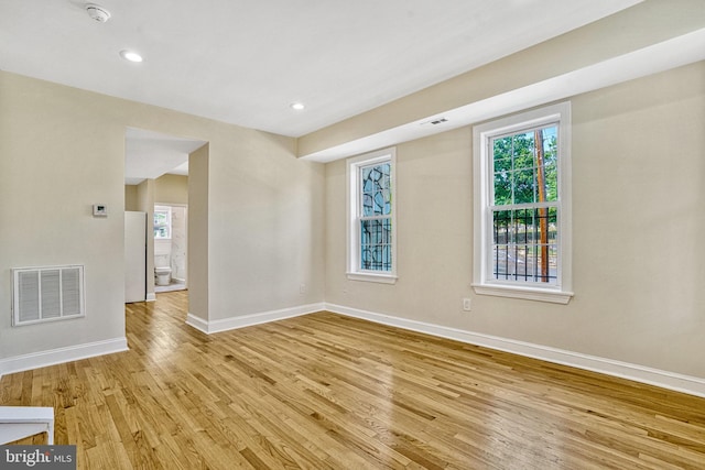 unfurnished room featuring light wood-type flooring