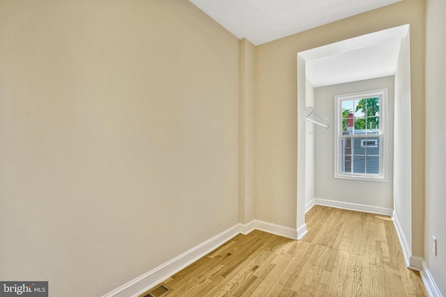 unfurnished room with light hardwood / wood-style floors