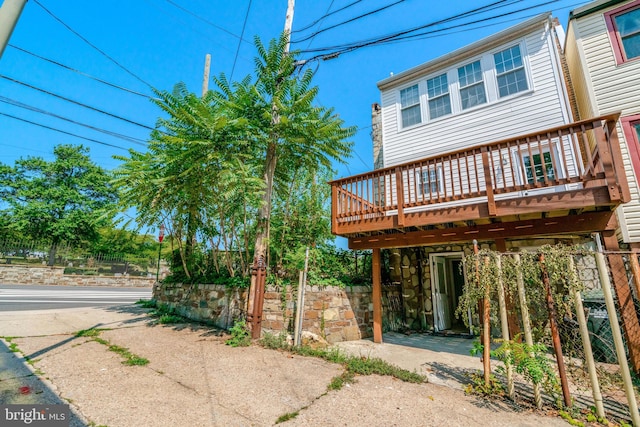 exterior space featuring a wooden deck