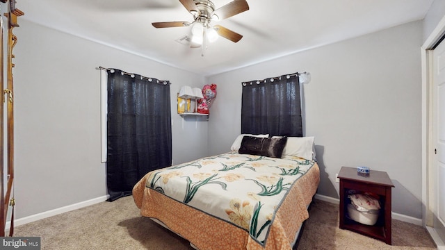 bedroom with ceiling fan and carpet