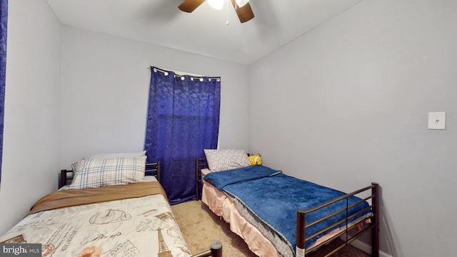 carpeted bedroom featuring vaulted ceiling and ceiling fan