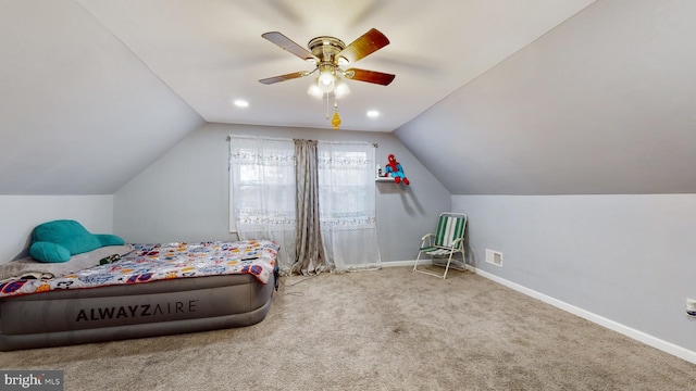 carpeted bedroom featuring ceiling fan and lofted ceiling