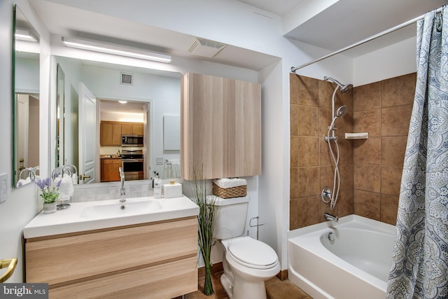 full bathroom featuring vanity, toilet, and shower / bath combo with shower curtain