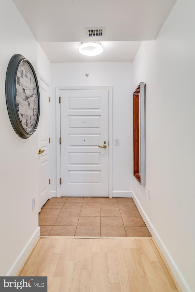 doorway to outside with light hardwood / wood-style floors