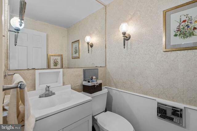 bathroom with toilet and vanity